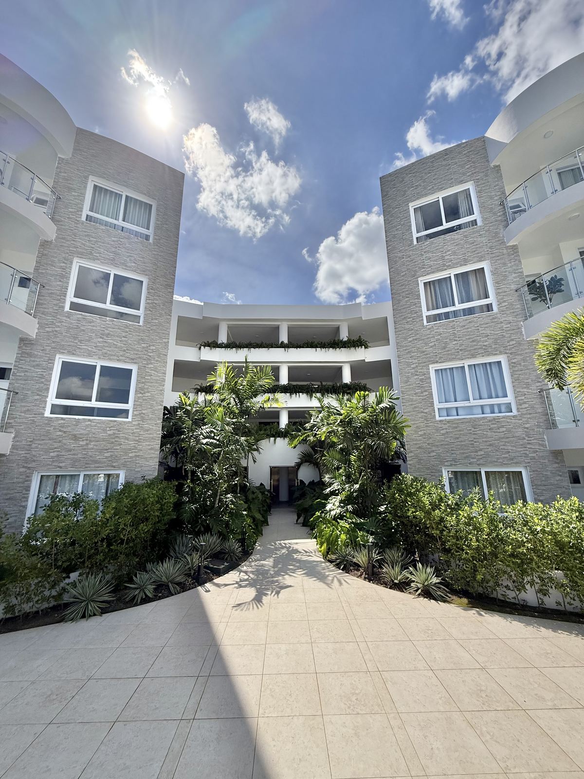 Facade entrance with tropical landscaping